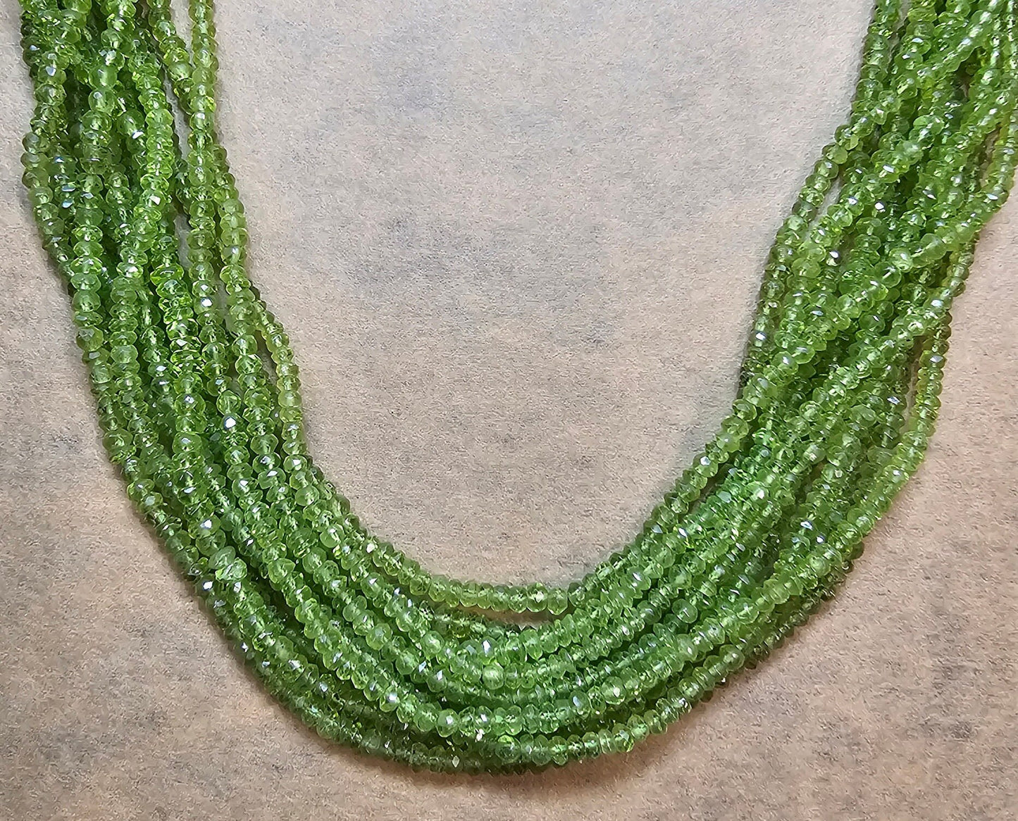 AA Peridot Gemstone Beads. Natural Rondelle Faceted Peridot Gemstone with strand length approx 14" Size 3-3.50, 3-4.50mm, 4-5mm