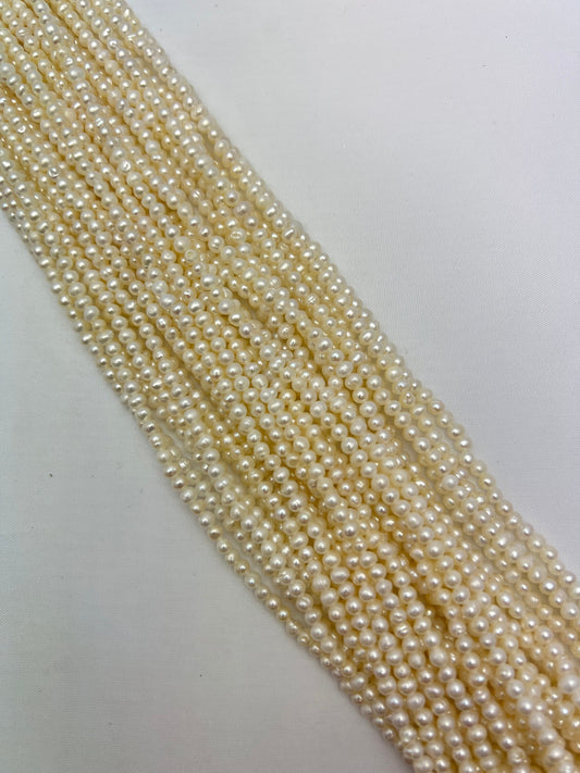Natural White Freshwater Pearl, Round Oval Shapes strand length 14.50 " size 4-5 mm